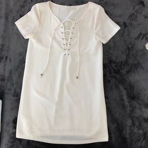 A white criss crossed mini dress